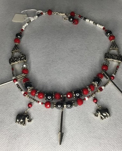 A doble stranded red,white , silver and hemitite beaded necklace with metal elephant and arrow charms - RK Queen B elegant Jewelry